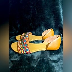 Andiamo multicolored wide width flats.